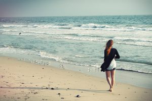 Woman Walks on the Beach